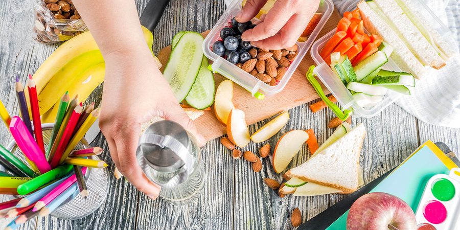 Mother-Preparing-School-healthy-back-to-school-snacks